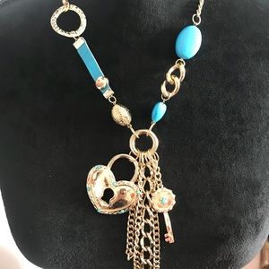 Baby blue necklace with bold colored charms